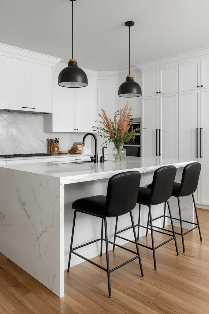 Matte black bar stools contrasting with a white marble kitchen island.