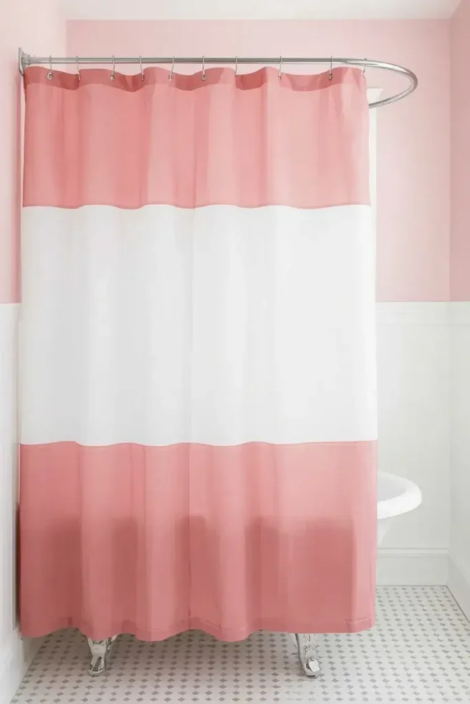 Pink and white color block curtain for a playful bathroom idea