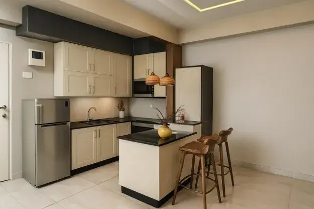 Small L shaped kitchen with compact island, beige cabinets, and space-saving design.