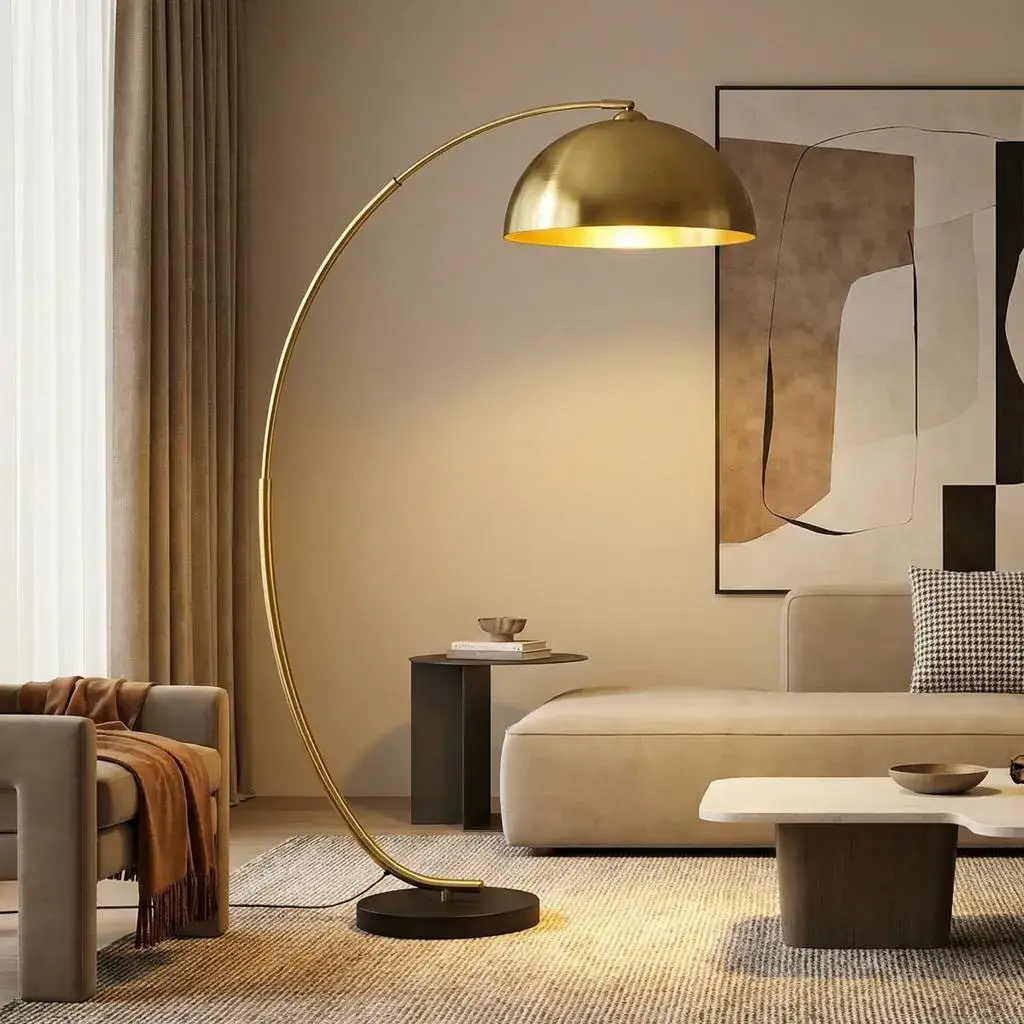Wooden tripod floor lamp adding sculptural style to a neutral modern living room.