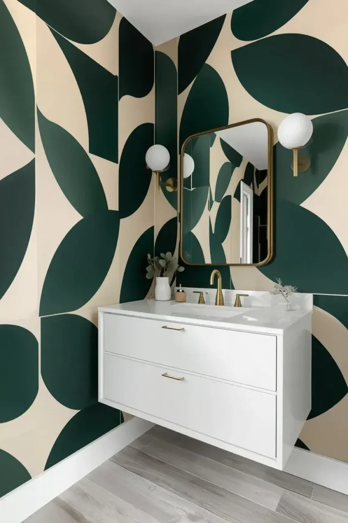 Bold geometric wallpaper bathroom with green and cream patterns, white vanity, and modern brass fixtures.