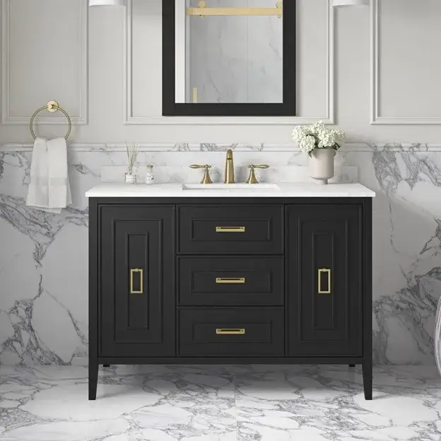 Matte black bathroom cabinet with gold handles, white marble countertop, and luxurious modern decor.
